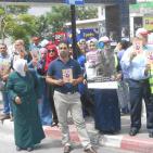 بالصور... وقفة لمكافحة عمالة الأطفال في الخليل