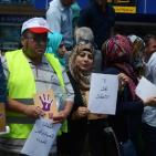 بالصور... وقفة لمكافحة عمالة الأطفال في الخليل