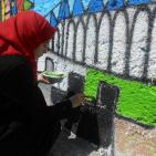 بالصور: المبادرات الشبابية ترسم جدارية 