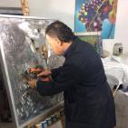 الفنان الرجبي يرسم لوحة 