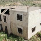 صور: شراء منزل لأسرة الشهيد مهند الحلبي