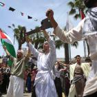 إعادة تمثيل مشهد من النكبة عام 1948 خلال مسيرة بمناسبة ذكرى النكبة في مدينة رام الله