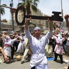 إعادة تمثيل مشهد من النكبة عام 1948 خلال مسيرة بمناسبة ذكرى النكبة في مدينة رام الله