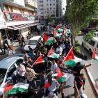 بالصور: مسيرة أعلام فلسطينية وسط رام الله إسنادا لأهلنا في القدس