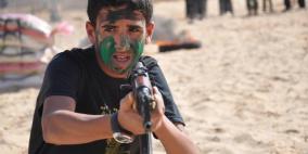 بالصور : بين لكلاشنكوف والارجوحه المخيمات الصيفية في غزة