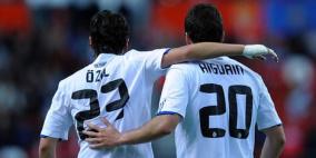 آرسنال أوزيل ونابولي هيجواين يدهشان أوروبا