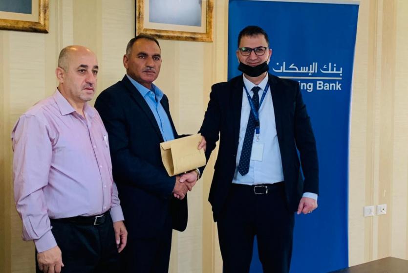 بنك الاسكان يدعم الأنشطة المجتمعية عبر المساهمة بتأهيل قاعة بلدية حلحول